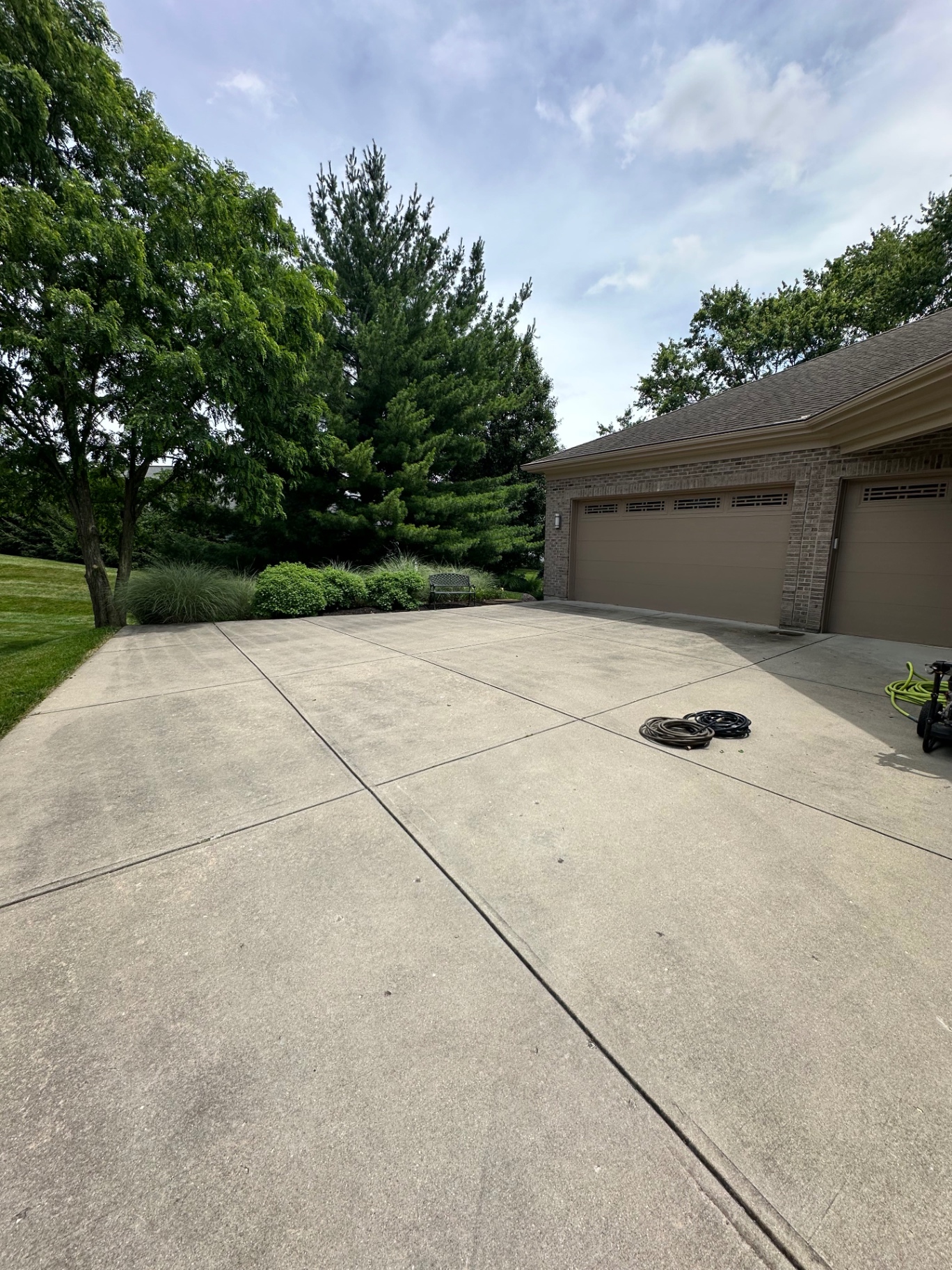Before three-car driveway wash in Northern Kentucky